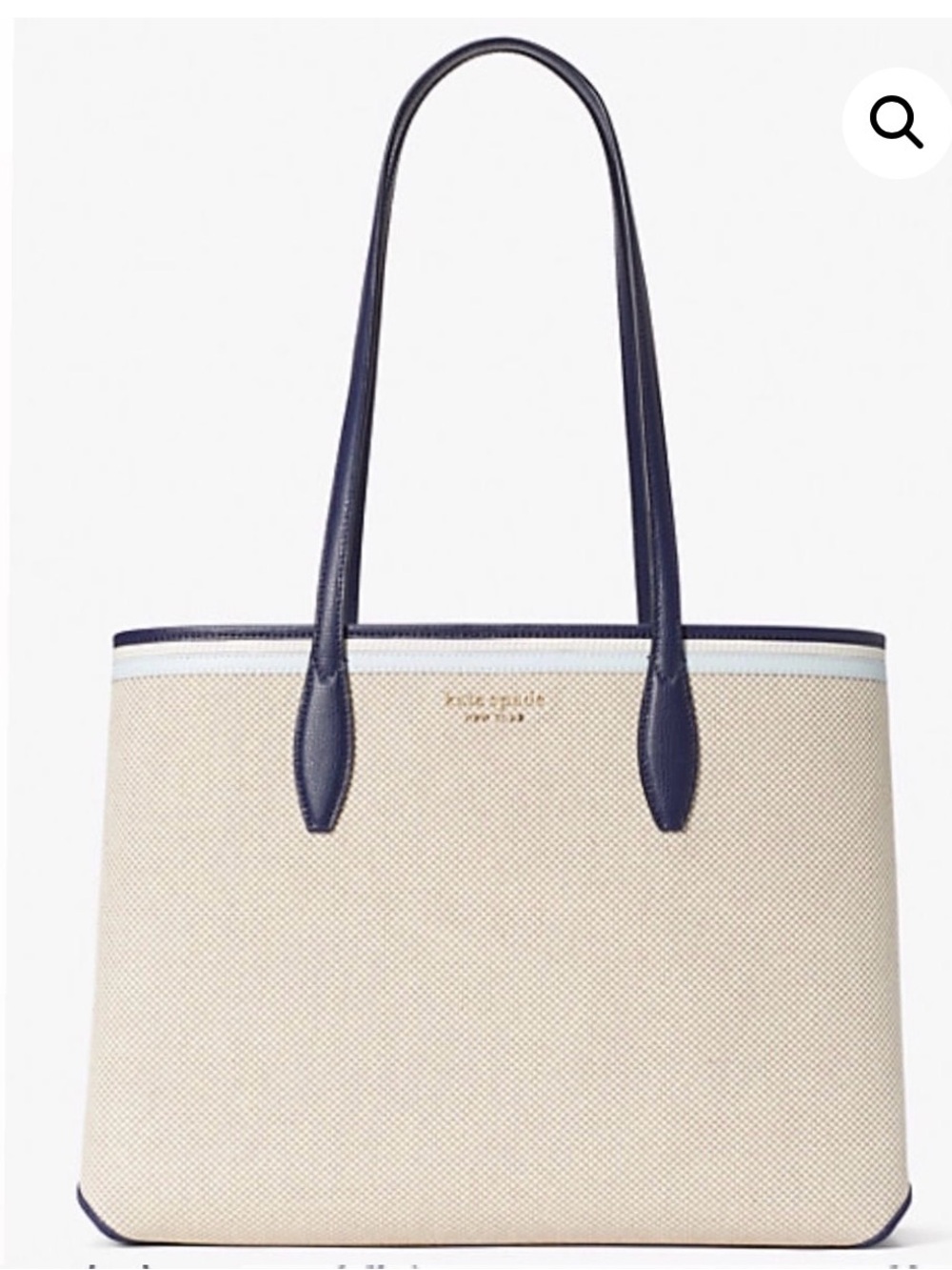 This bag is a Kate Spade All Day Canvas Large Tote with blue leather trim.